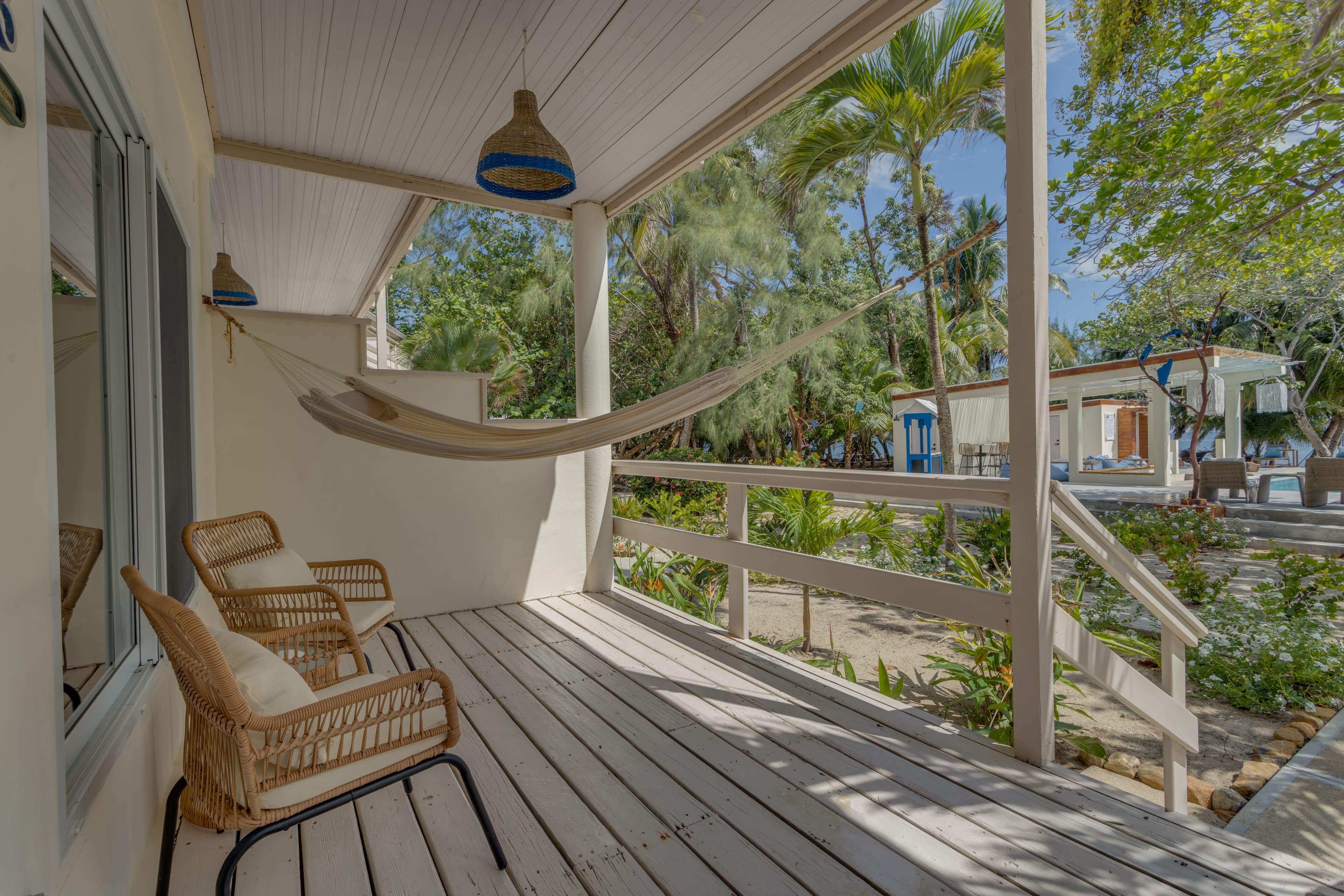 Private verandah steps from the pool and sea